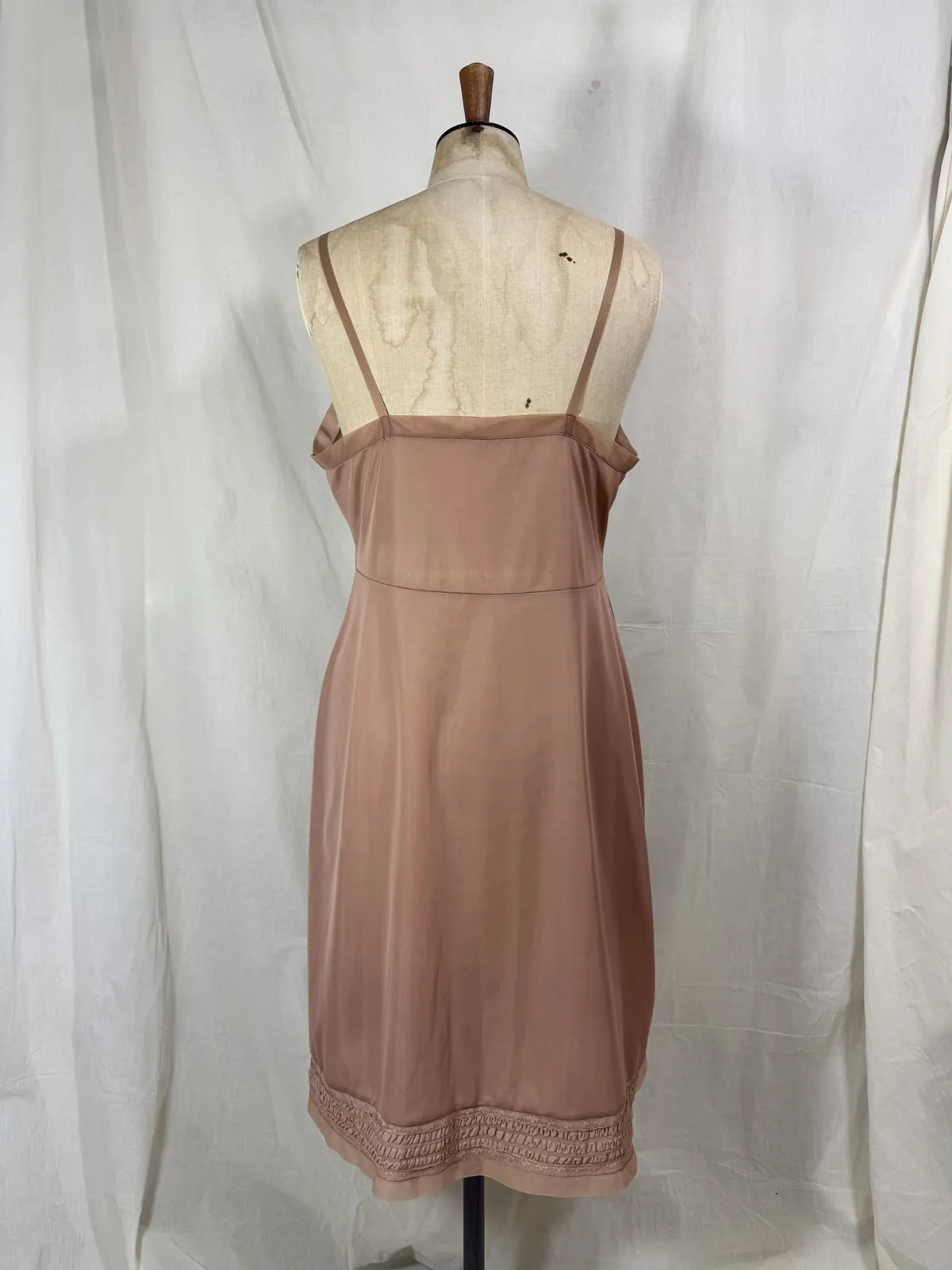 Brown satin nightgown on a mannequin with a white background