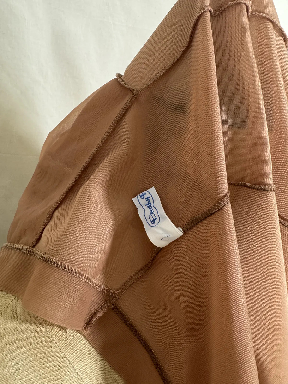 Brown satin nightgown on a mannequin with a white background