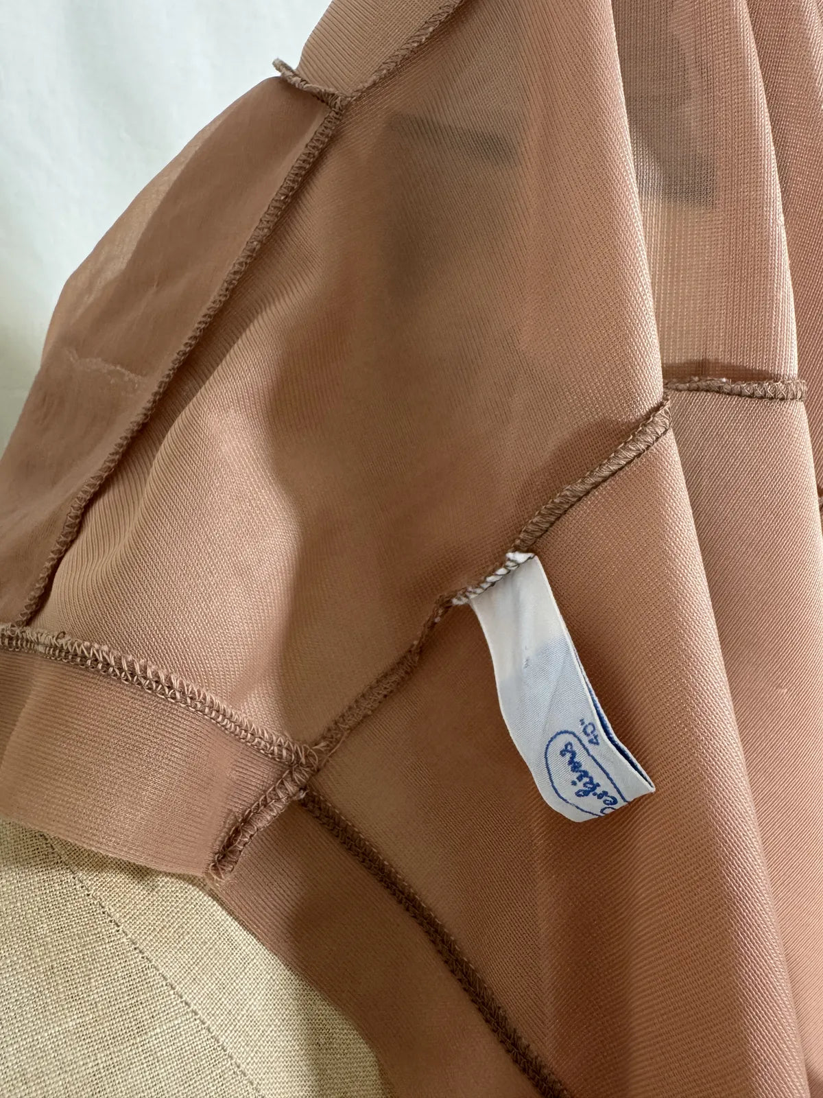 Brown satin nightgown on a mannequin with a white background