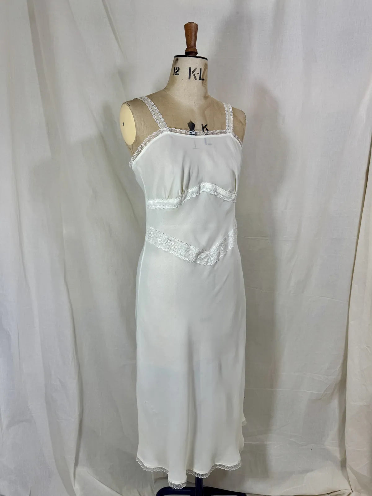 White dress on a mannequin against a white background