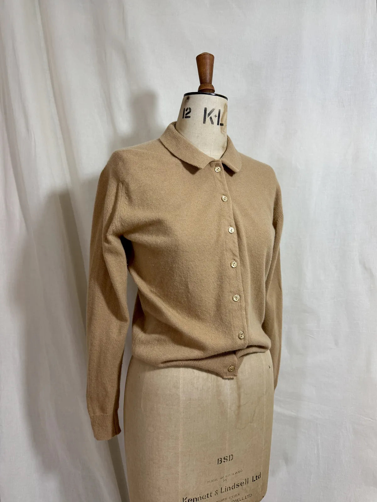 Brown cardigan against white backdrop