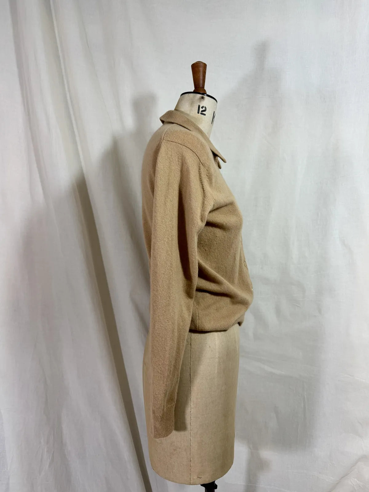 Brown cardigan against white backdrop