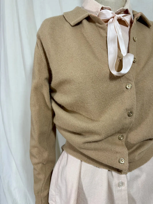 Brown cardigan against white backdrop