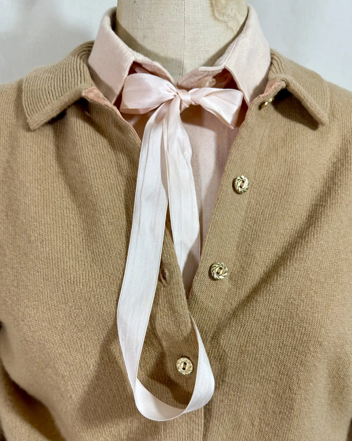 Brown cardigan against white backdrop