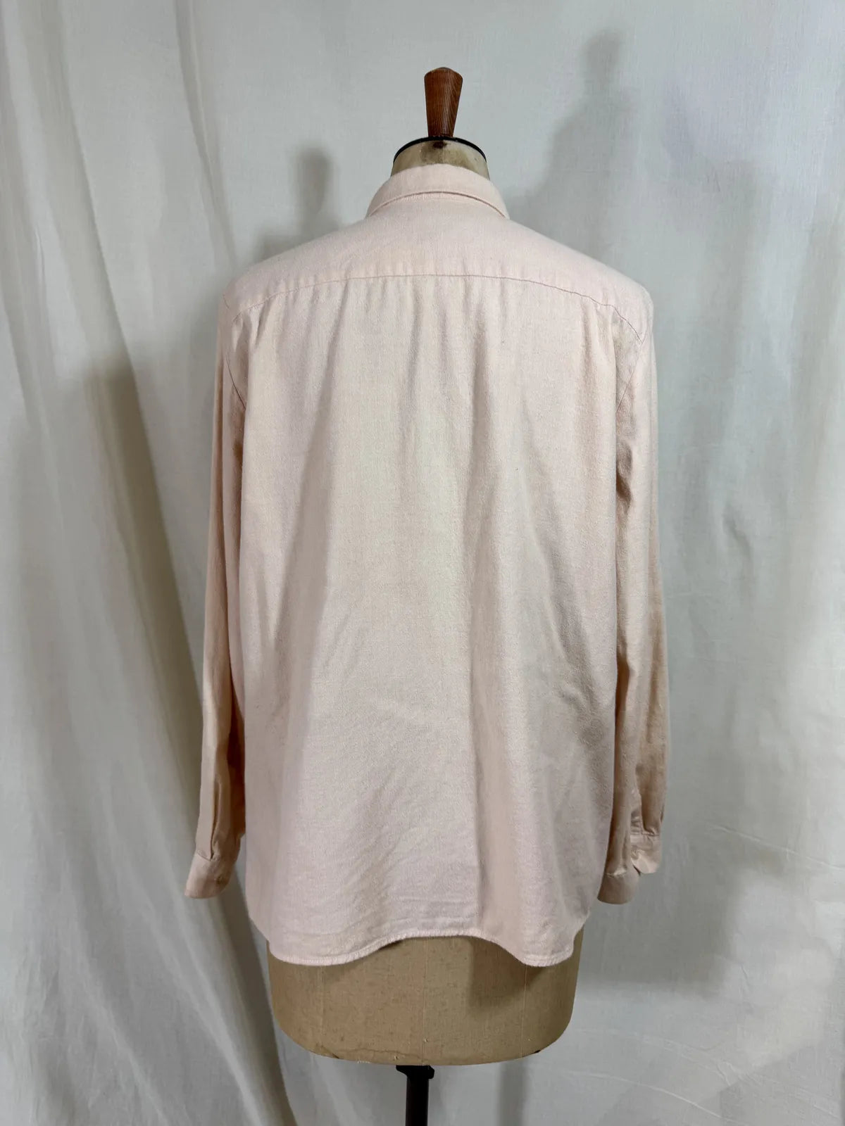 Pink naturally dyed shirt against a white background