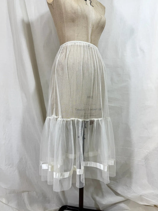 long white cotton tulle petticoat against a white background