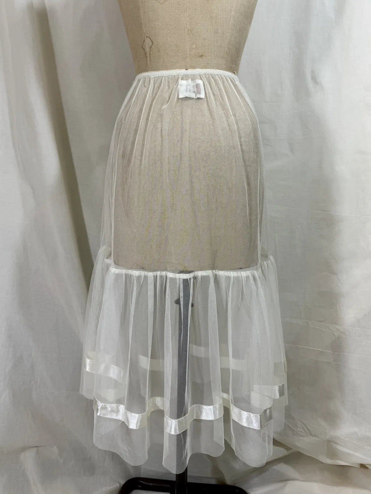 long white cotton tulle petticoat against a white background