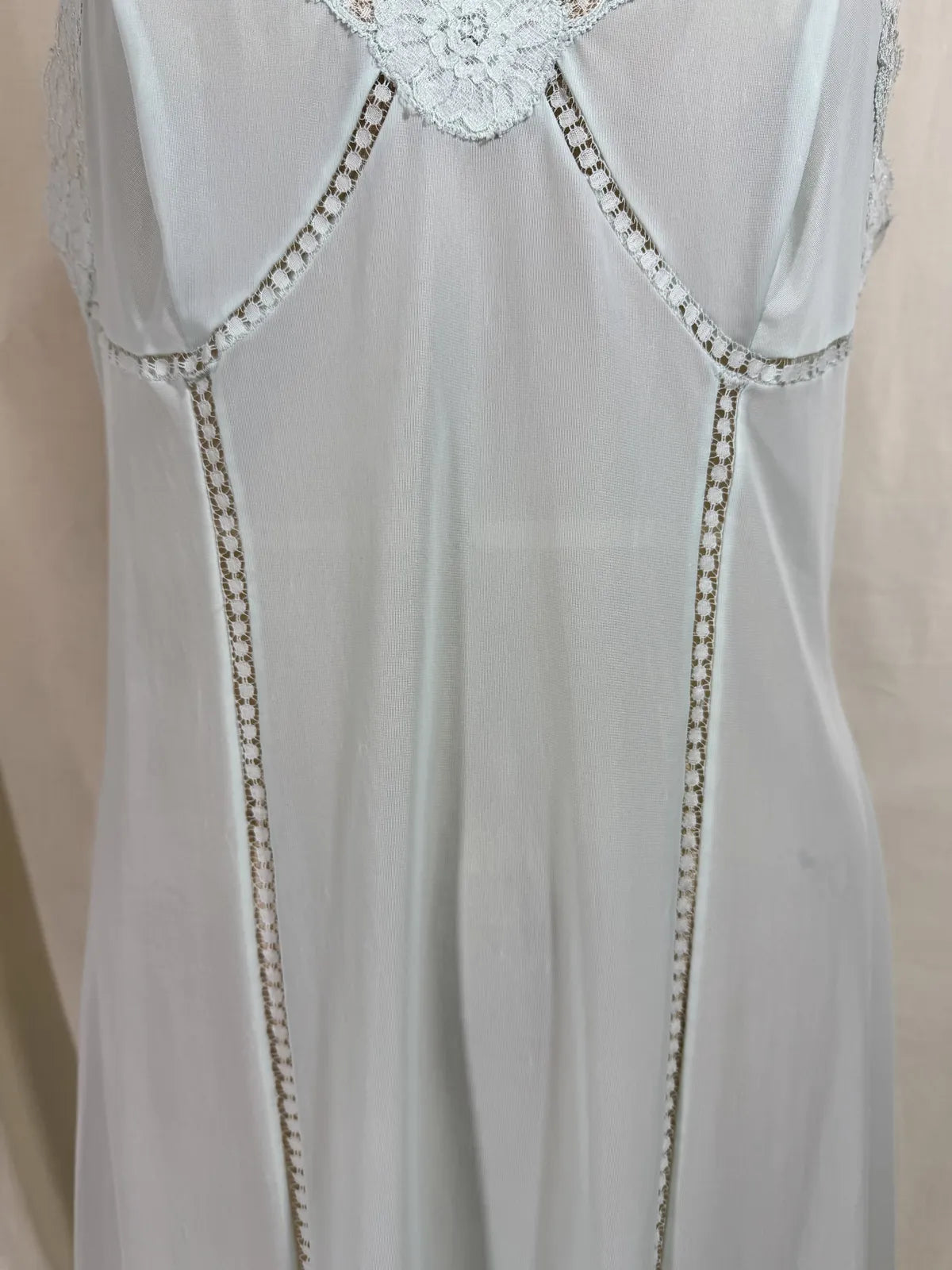 Light blue slip dress on a mannequin against a white background
