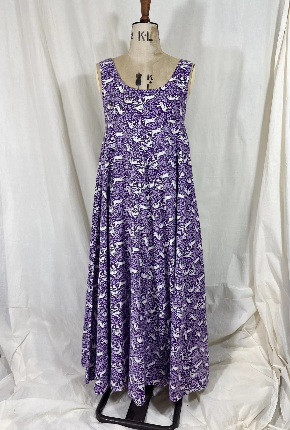 Purple maxi dress with lion and deer print on mannequin 