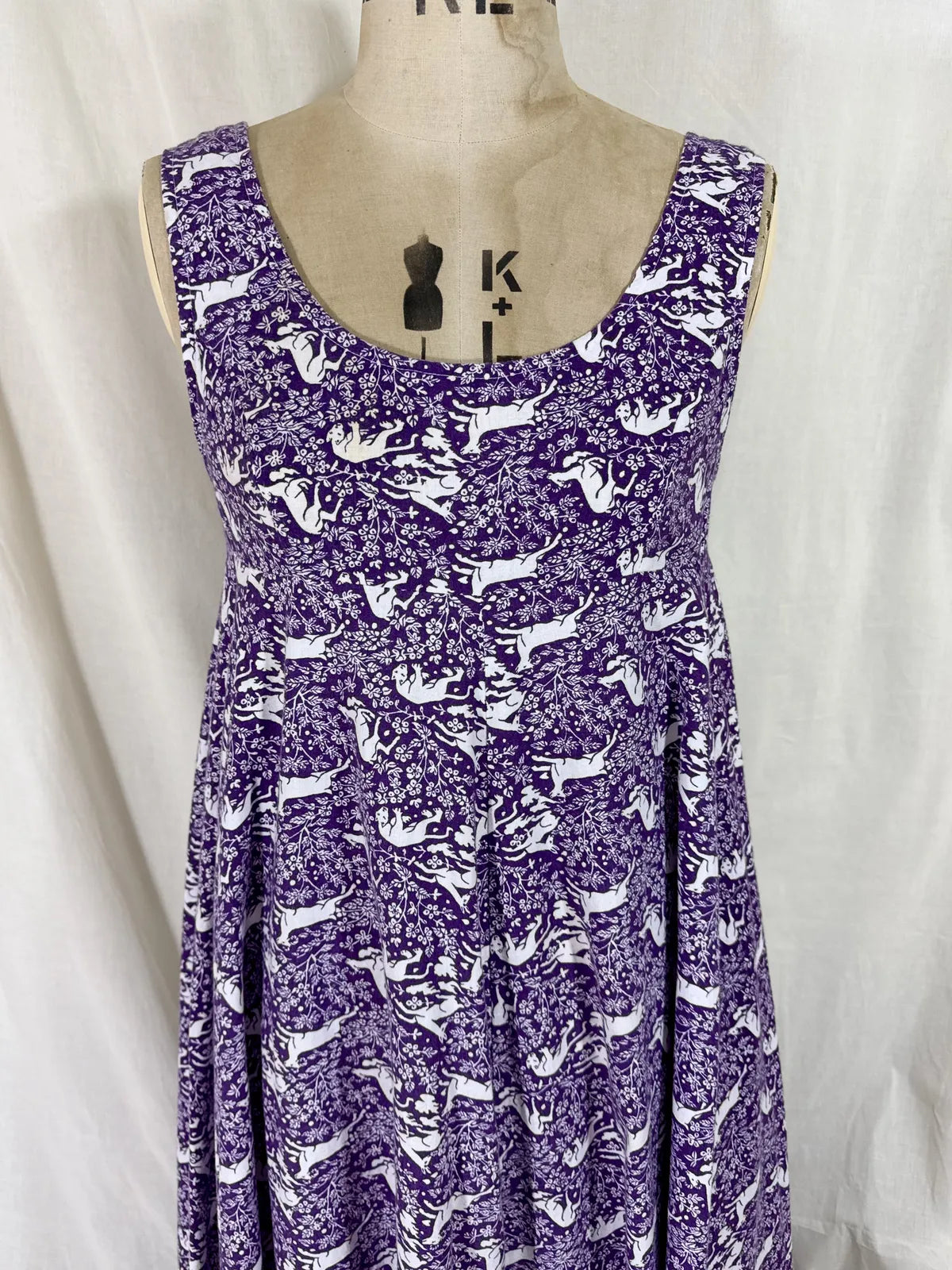 Purple maxi dress with lion and deer print on mannequin 