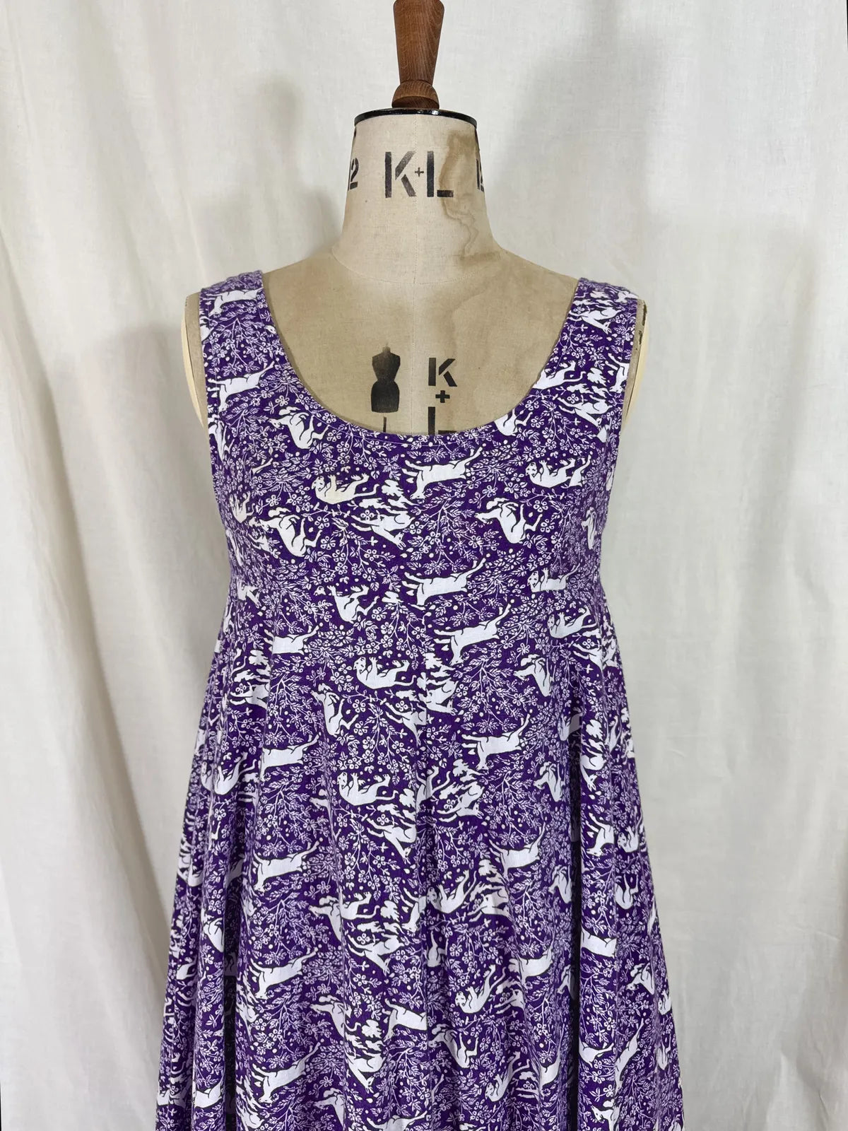 Purple maxi dress with lion and deer print on mannequin 