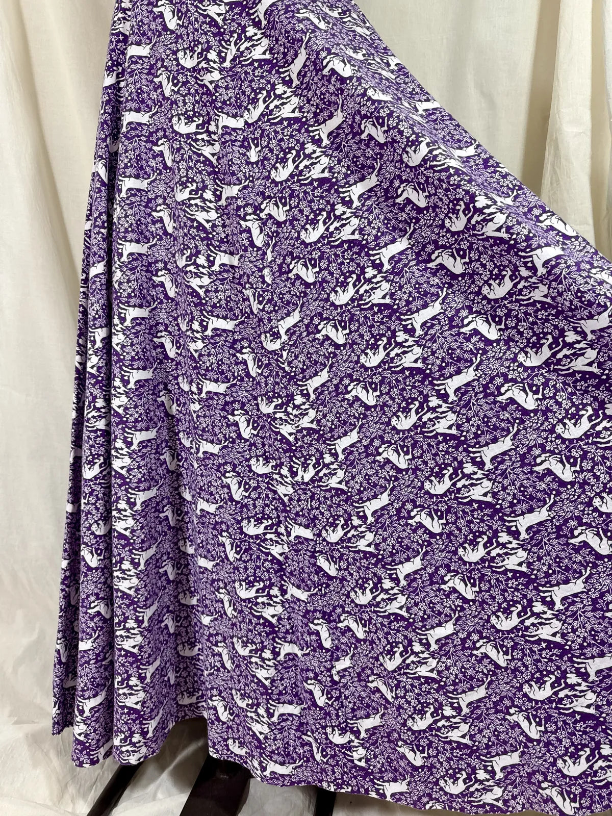 Purple maxi dress with lion and deer print on mannequin 