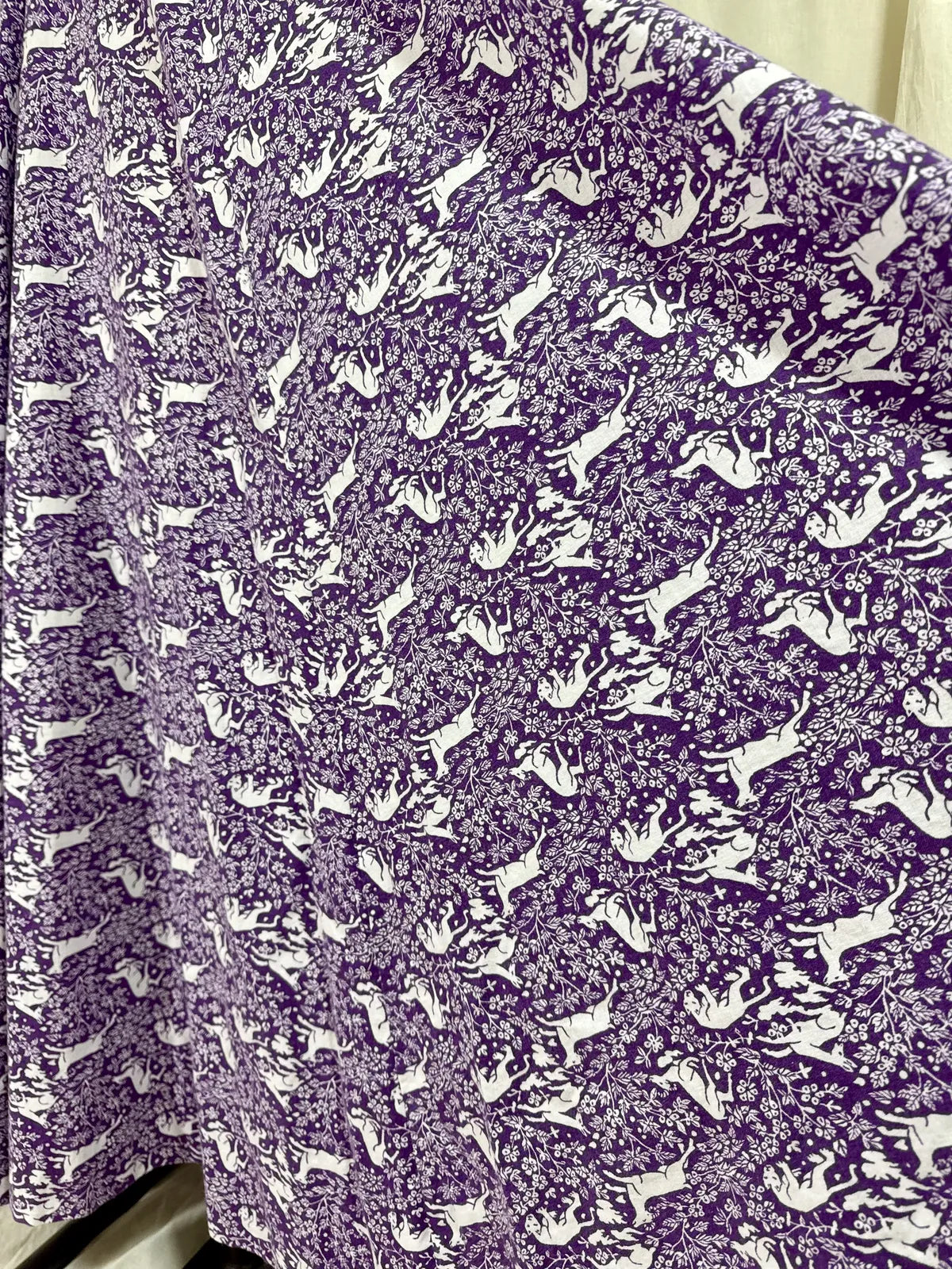 Purple maxi dress with lion and deer print on mannequin 