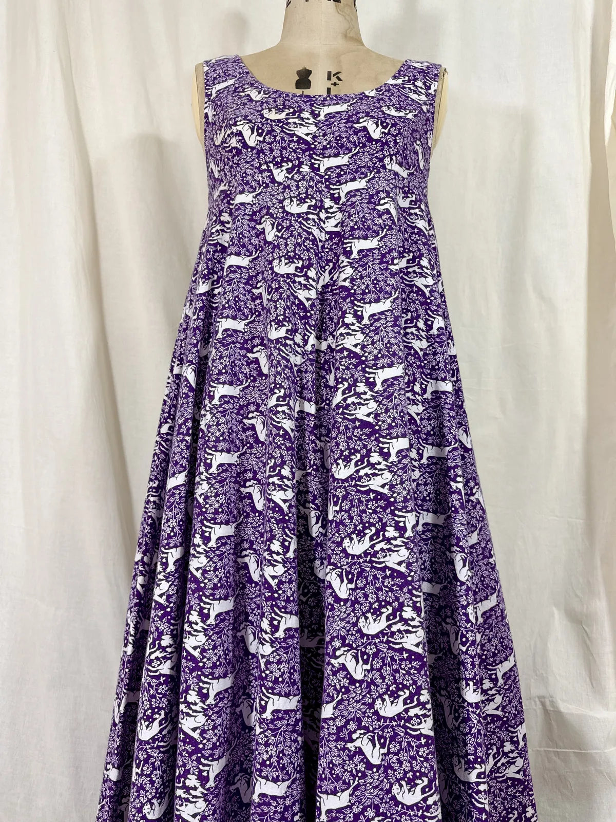 Purple maxi dress with lion and deer print on mannequin 