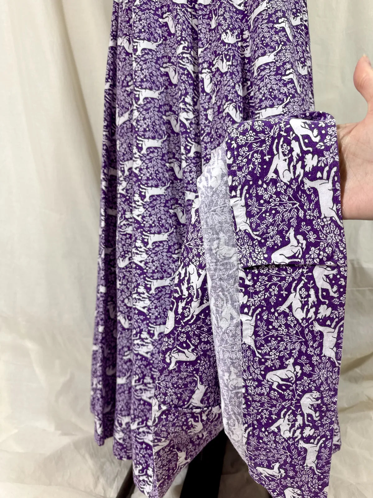 Purple maxi dress with lion and deer print on mannequin 