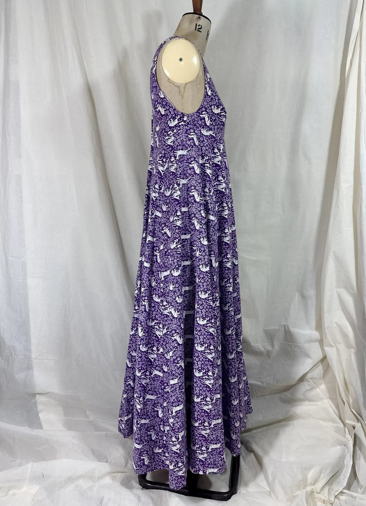 Purple maxi dress with lion and deer print on mannequin 