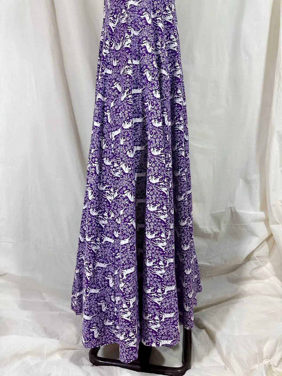 Purple maxi dress with lion and deer print on mannequin 