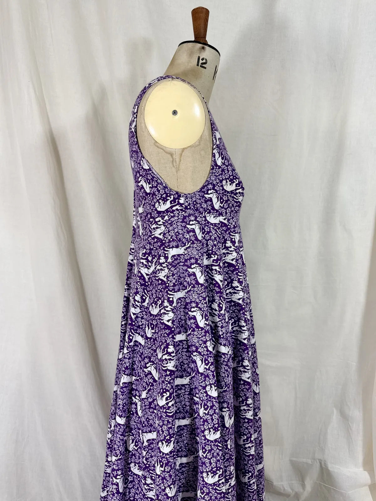 Purple maxi dress with lion and deer print on mannequin 