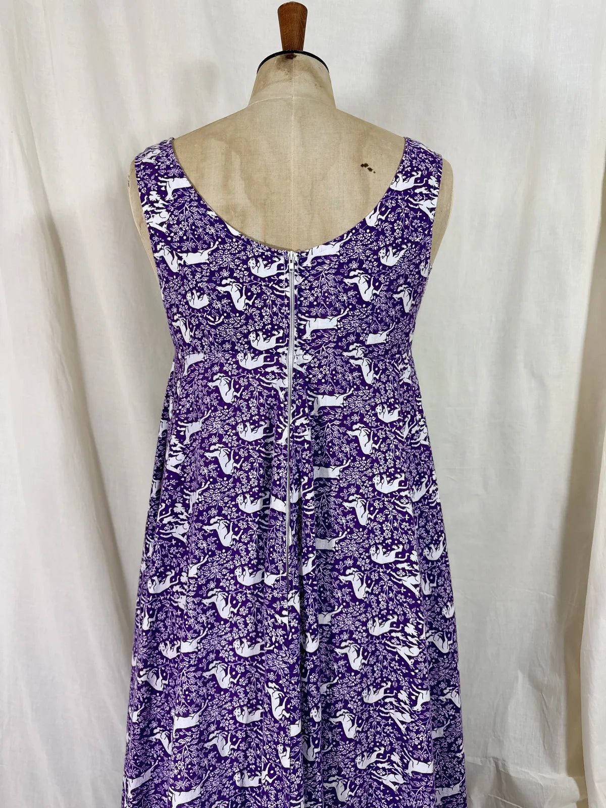 Purple maxi dress with lion and deer print on mannequin 