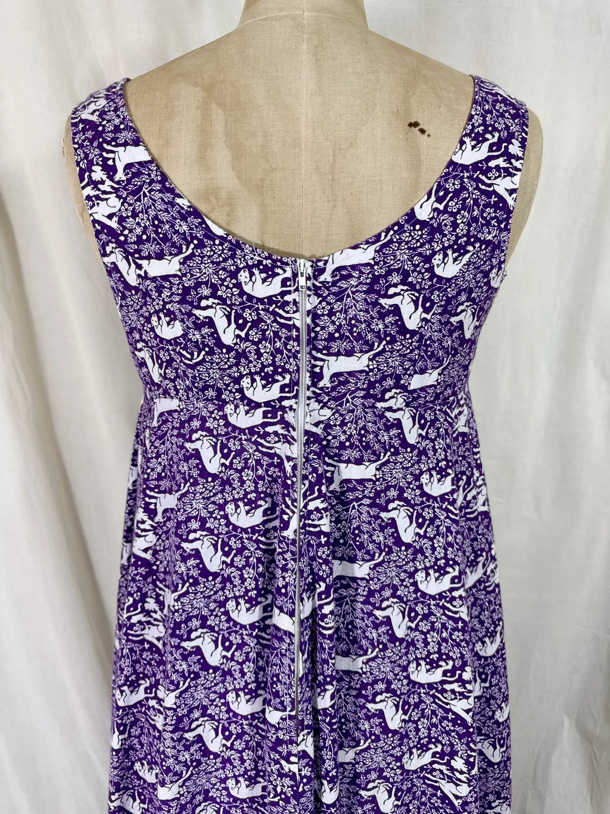 Purple maxi dress with lion and deer print on mannequin 