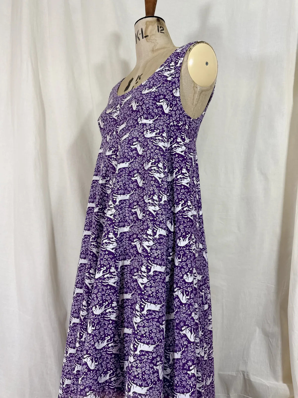 Purple maxi dress with lion and deer print on mannequin 
