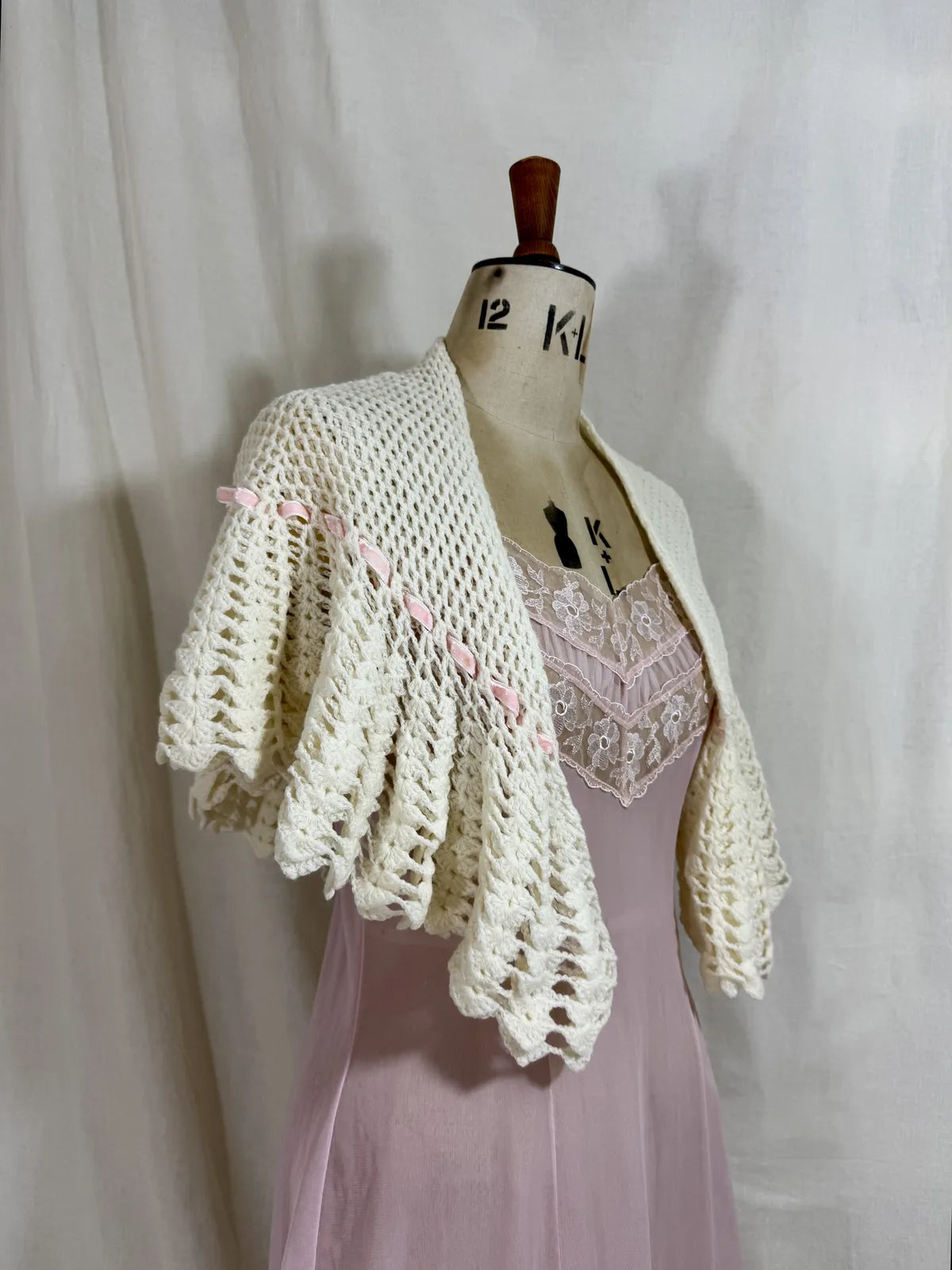1930s cream crochet shawl with pink velvet ribbon