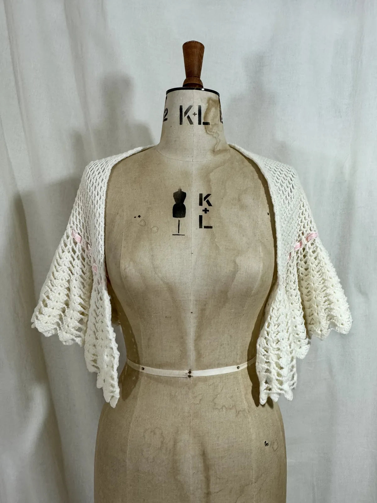 1930s cream crochet shawl with pink velvet ribbon