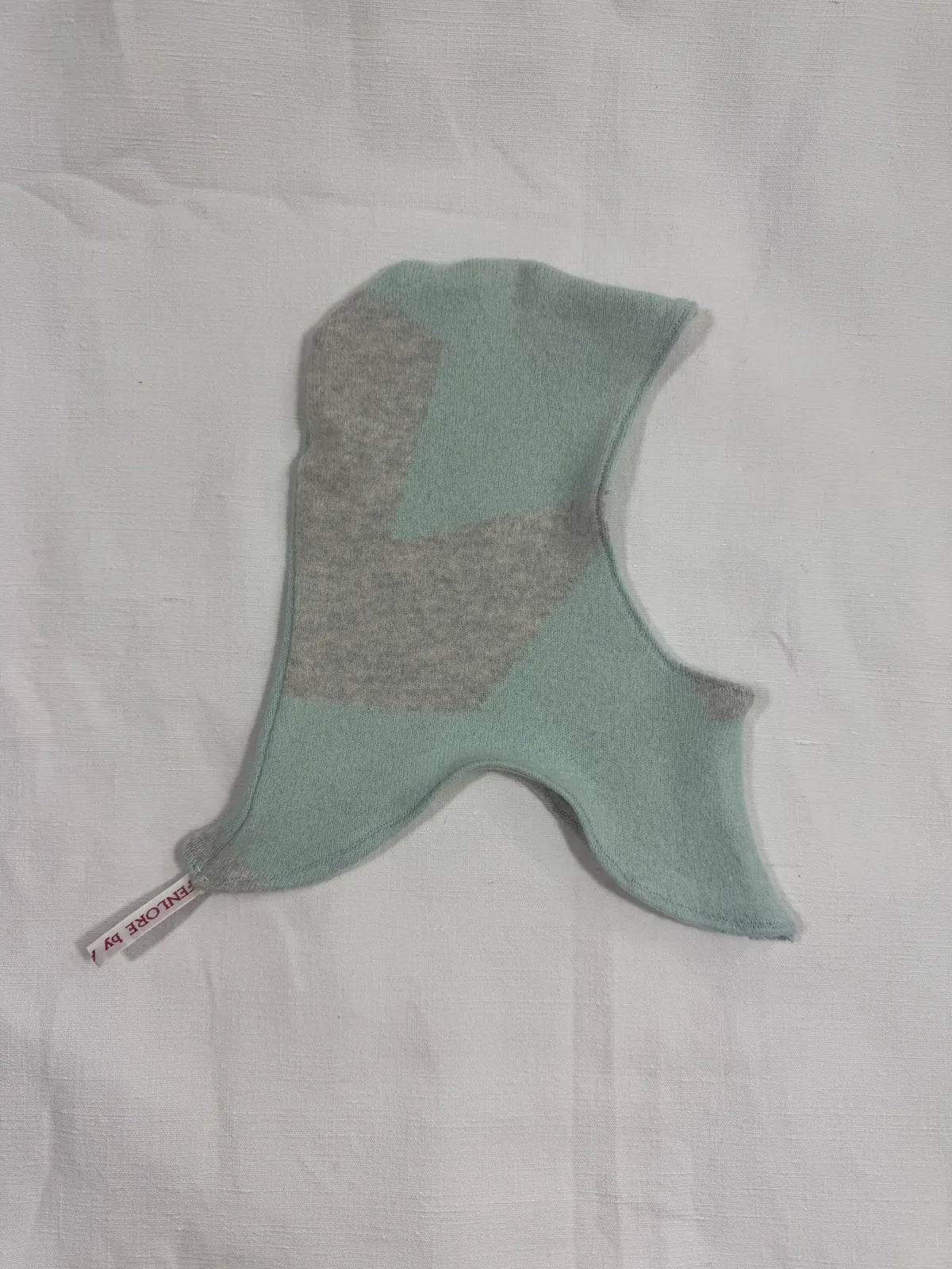 Grey /& turquoise cashmere hood for infant on a white background