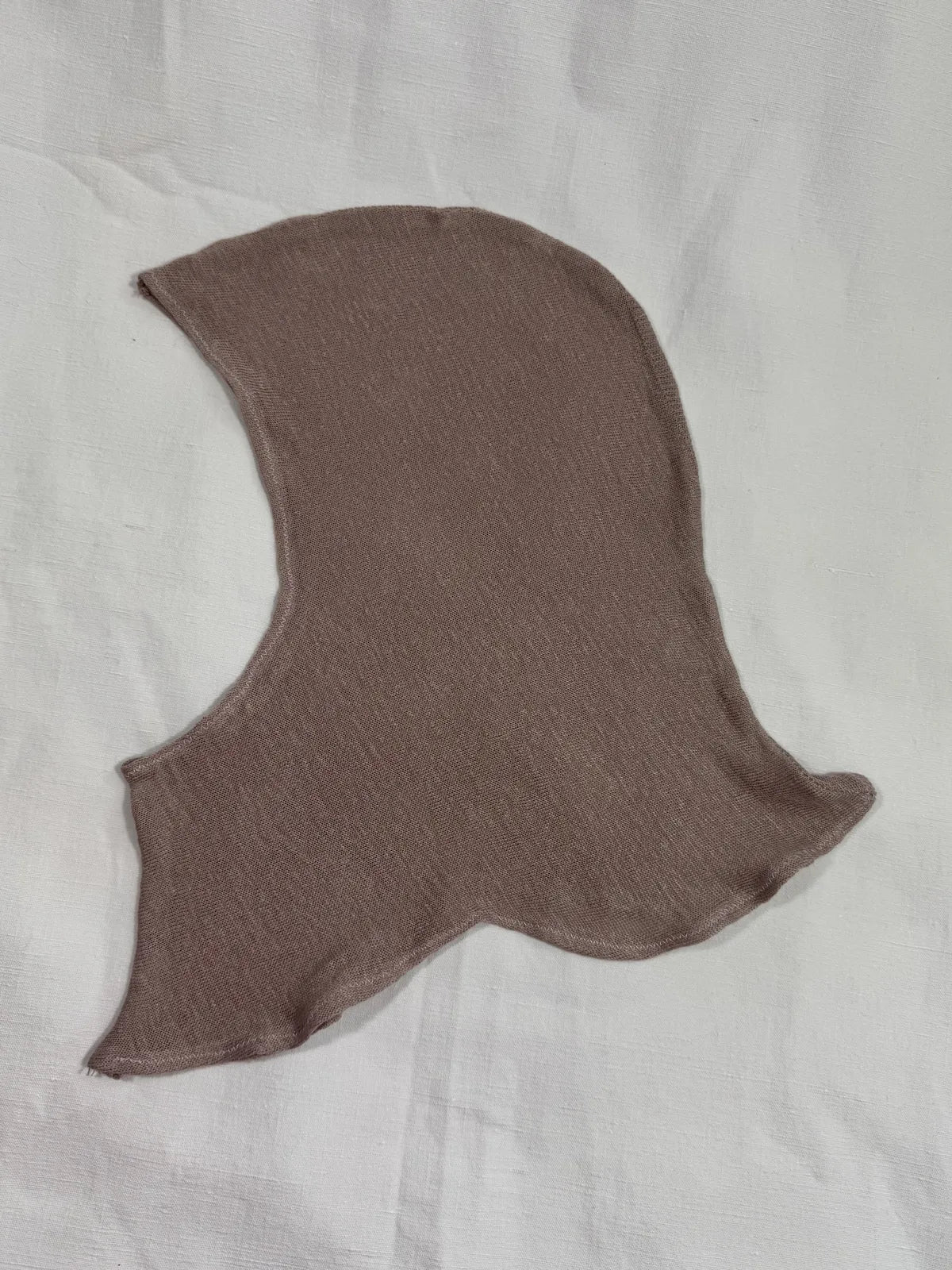 silk knitted lilac hood against white backdrop