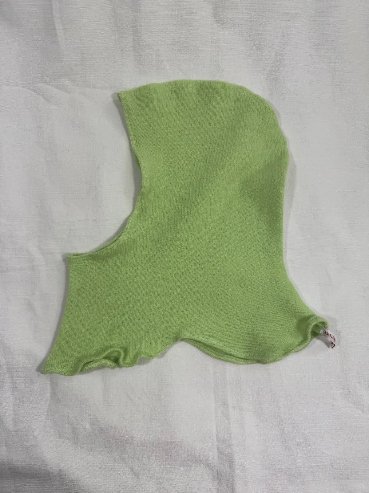 handmade green cashmere hood on white background