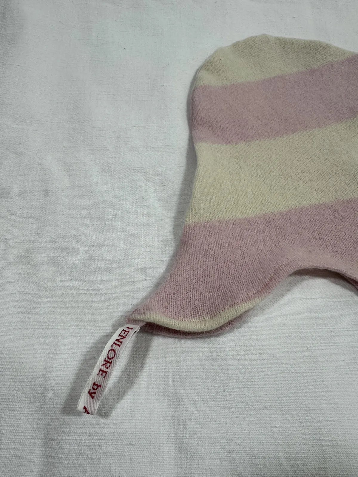 Striped fabric cashmere hood for infant on a white background