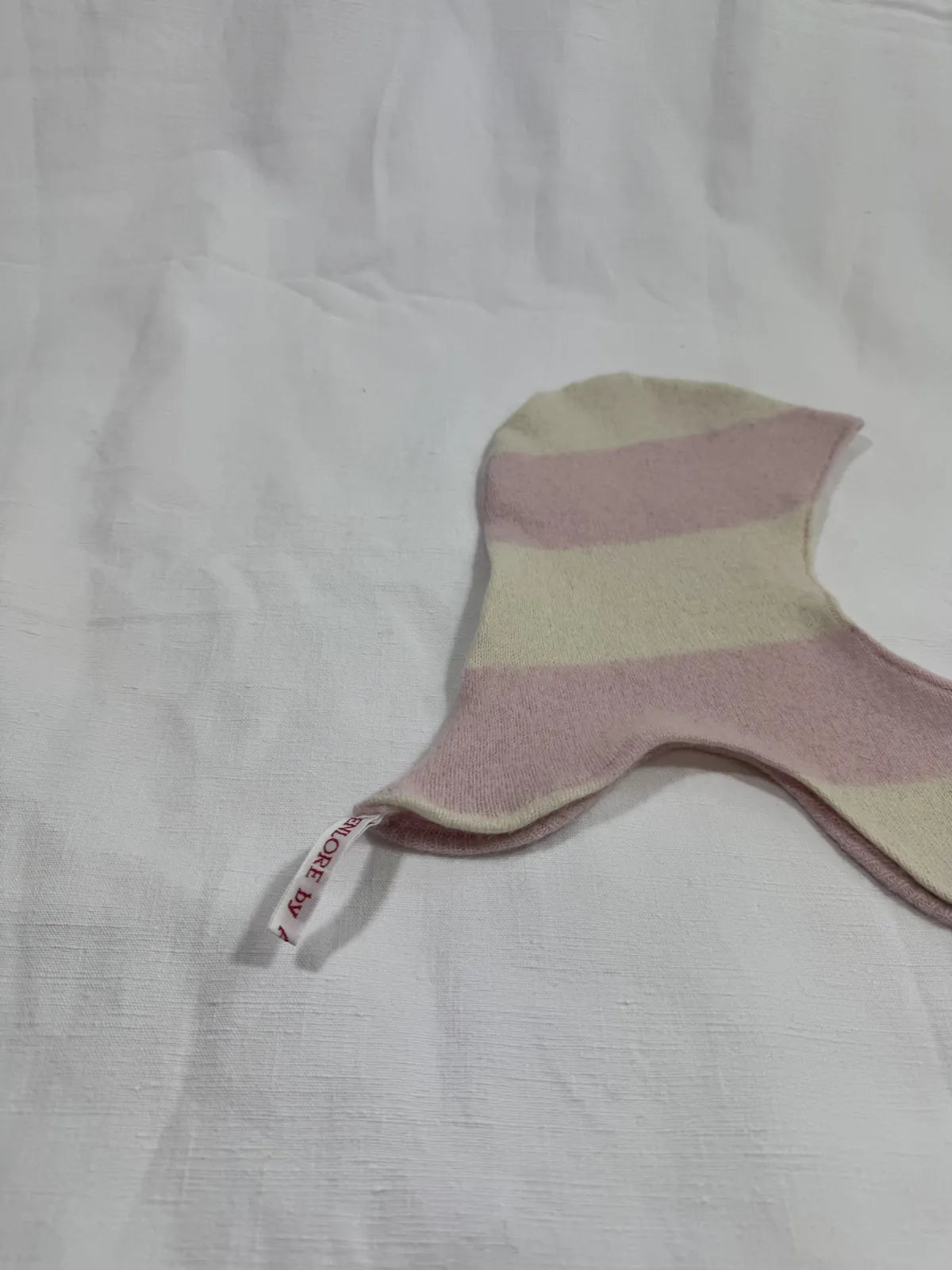 Striped fabric cashmere hood for infant on a white background