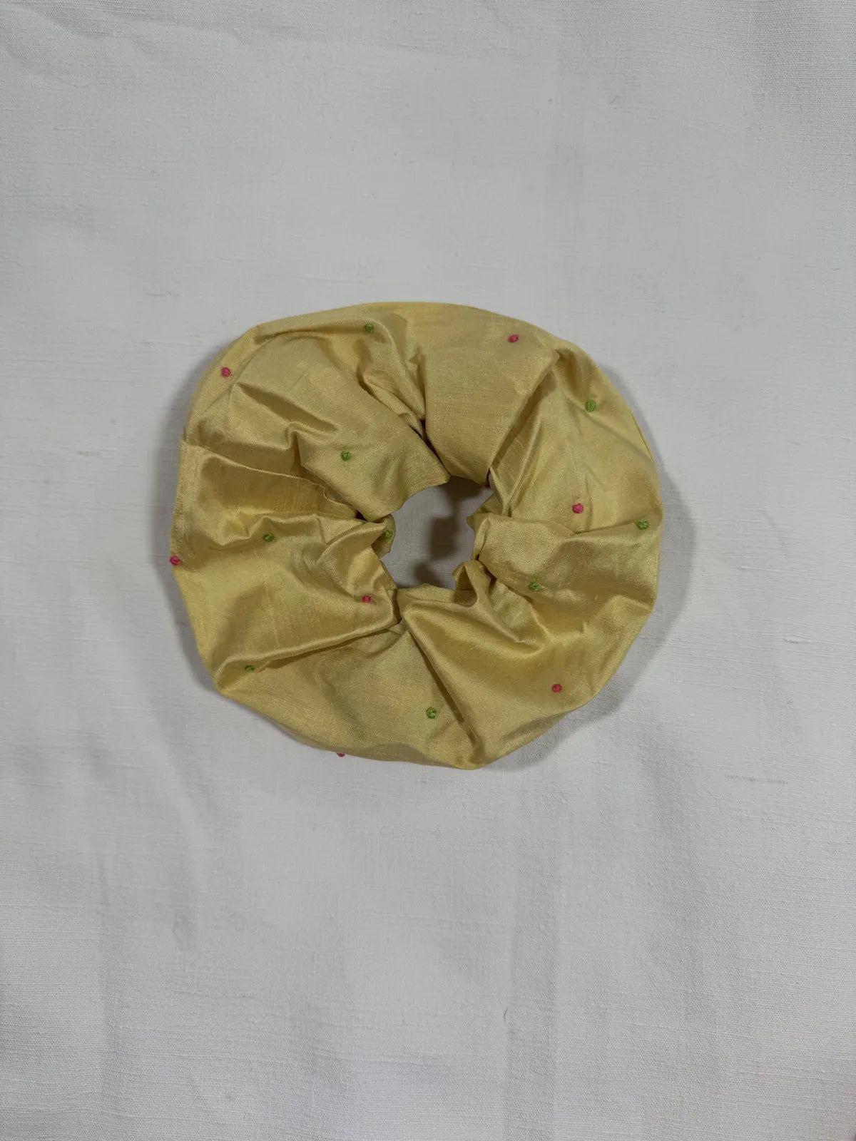 extra large yellow silk scrunchie with hand embroidery on white background