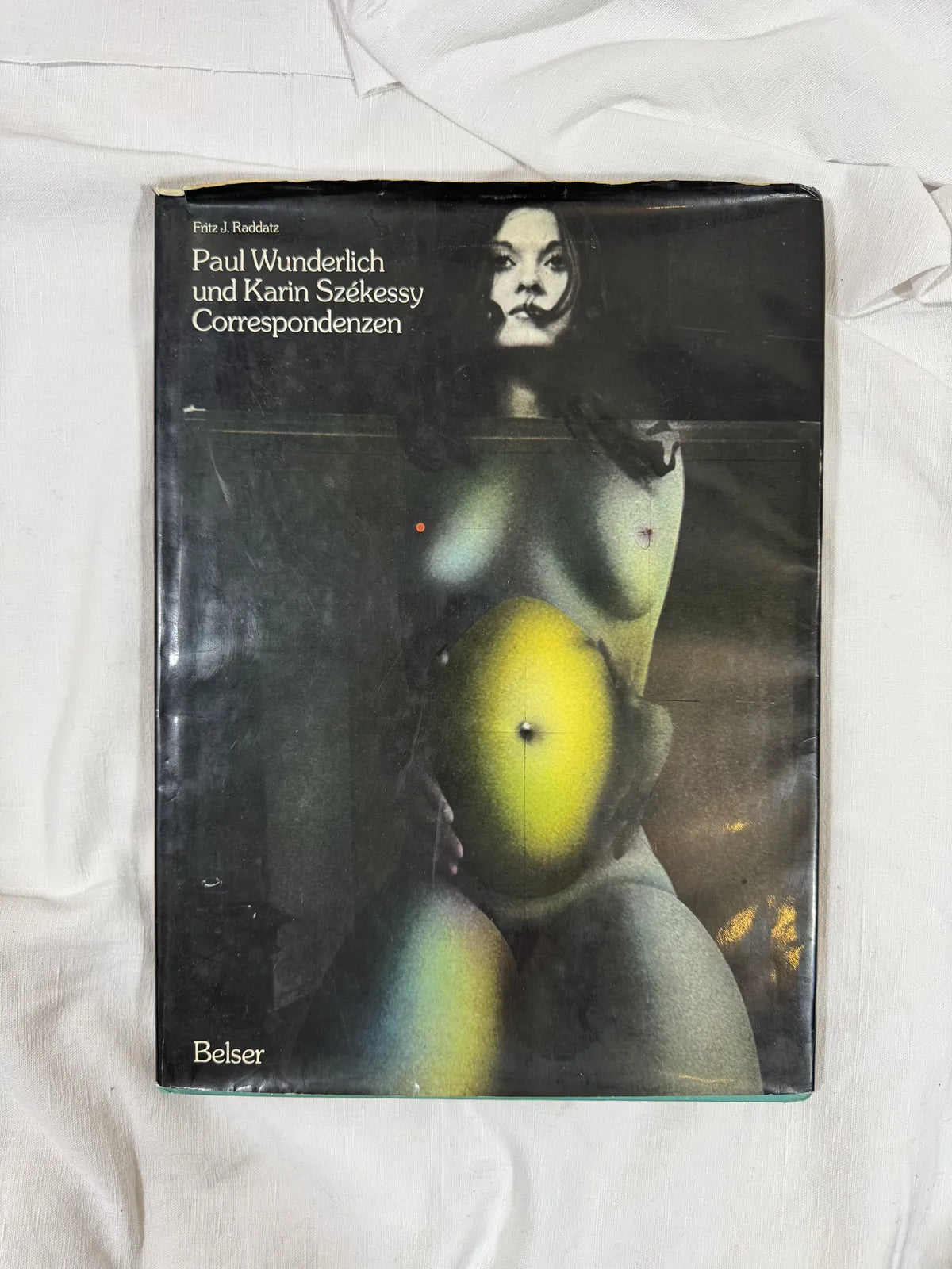 Book cover with a stylized illustration of a woman and text on a white background